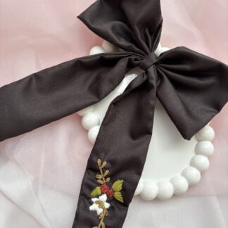 New Arrivals brown hair bow